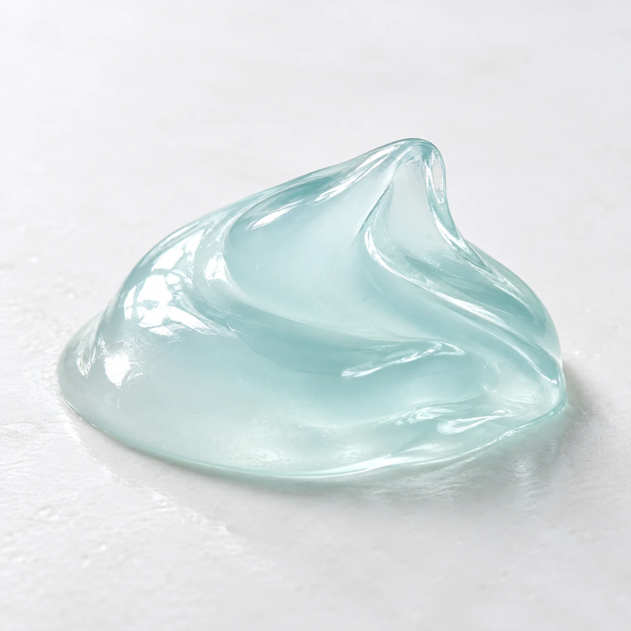 Translucent gel folded into one rounded form on a simple studio surface